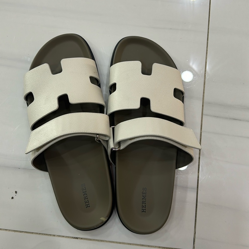 Hermès Chypre Leather Slides
Man.  white and grey